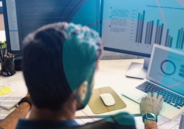 Business person reviewing data on a laptop