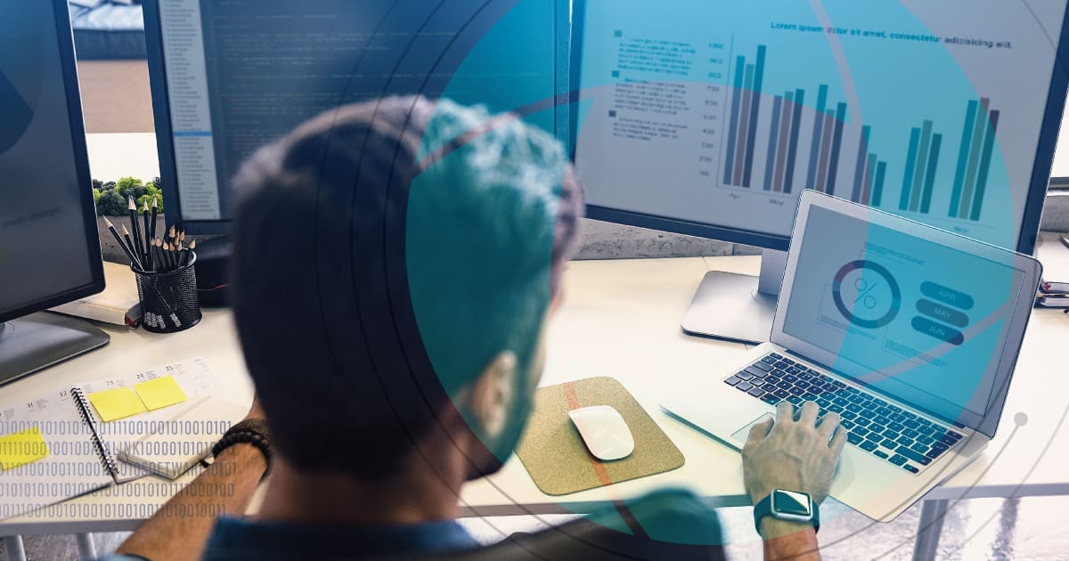 Business person reviewing data on a laptop