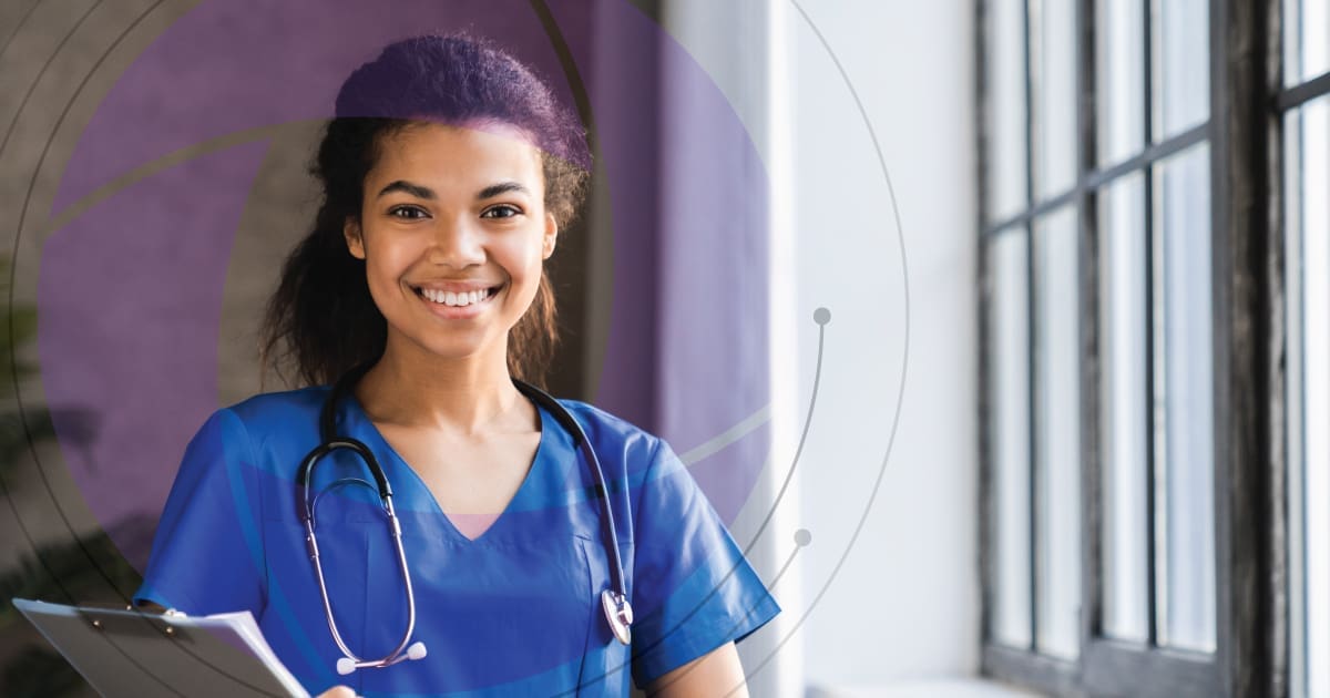 Nurse standing with stethoscope around neck and tablet