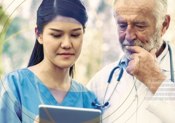 Doctor and nurse discussing medical notes on tablet